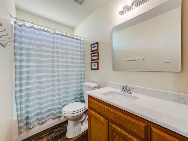 full bathroom with shower / bathtub combination with curtain, vanity, and toilet