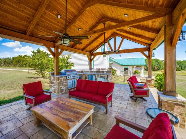 view of patio featuring an outdoor kitchen, an outdoor living space, ceiling fan, a gazebo, and grilling area