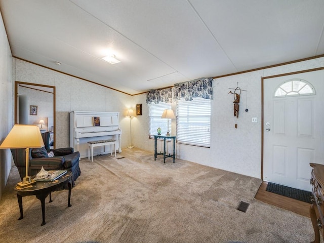 entryway featuring carpet floors and crown molding