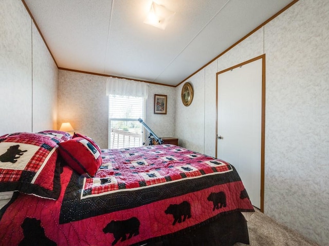 bedroom with carpet floors and lofted ceiling