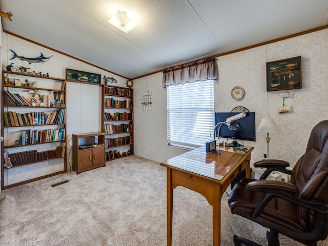 home office featuring light carpet and vaulted ceiling