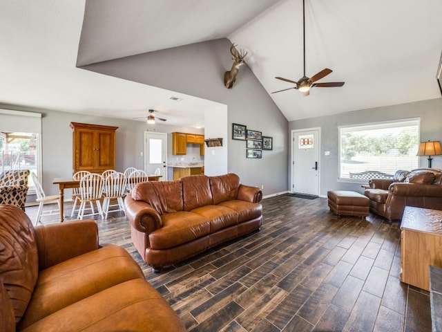 living room featuring ceiling fan and lofted ceiling