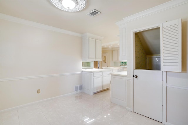 bathroom featuring tile patterned flooring and crown molding