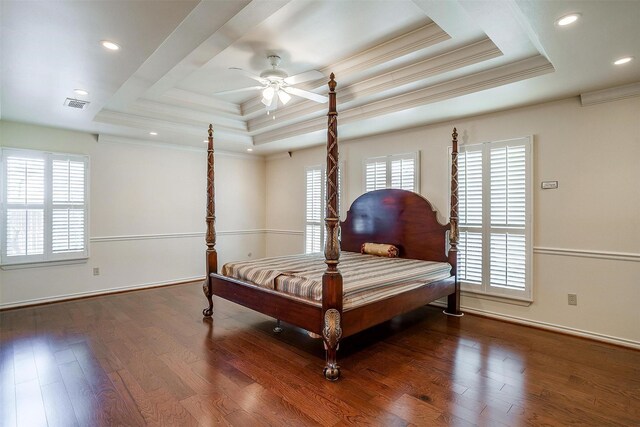 bedroom featuring a raised ceiling, wood-type flooring, ceiling fan, and crown molding