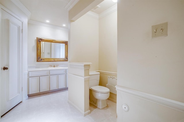 bathroom with vanity, tile patterned flooring, ornamental molding, and toilet