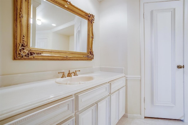 bathroom featuring crown molding, tile patterned floors, and vanity