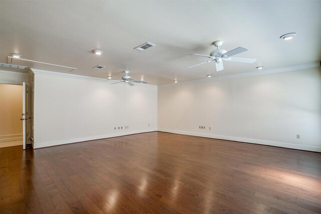 empty room with dark wood-type flooring, ceiling fan, and ornamental molding