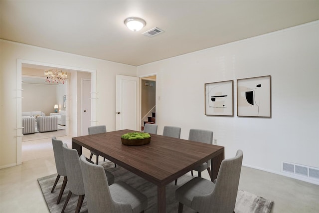 dining area featuring a notable chandelier