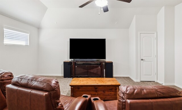 carpeted cinema with vaulted ceiling and ceiling fan