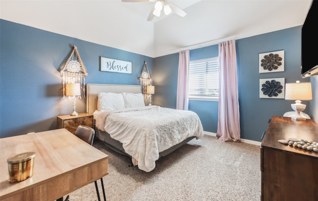 bedroom featuring carpet flooring, vaulted ceiling, and ceiling fan