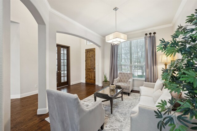 living room featuring ceiling fan, a fireplace, and dark wood-type flooring