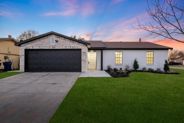 view of front facade featuring a yard and a garage