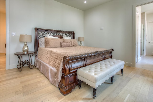 bedroom with light hardwood / wood-style flooring