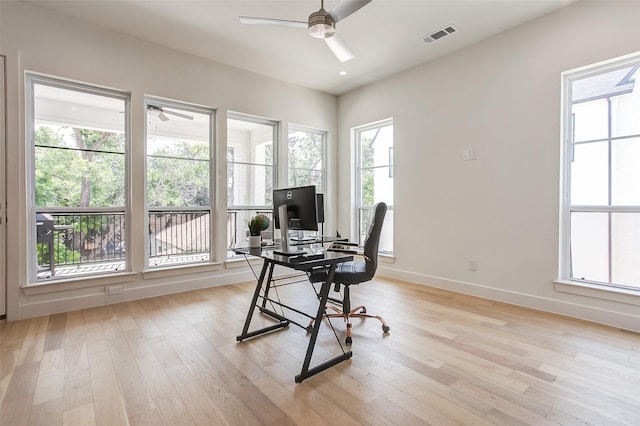 office area with light hardwood / wood-style flooring and ceiling fan