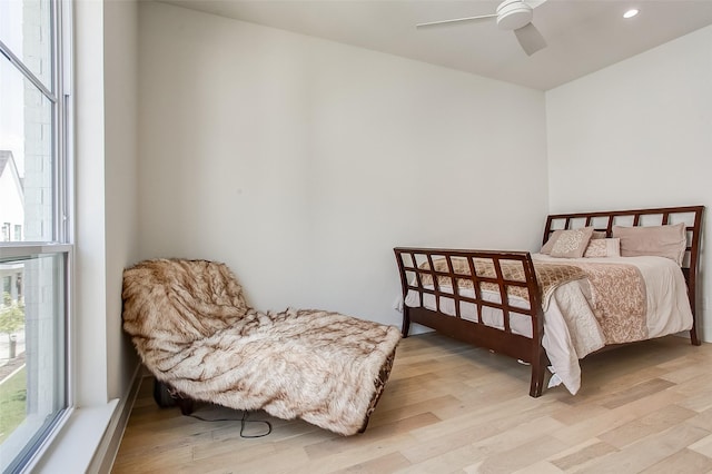 bedroom featuring ceiling fan and light hardwood / wood-style floors