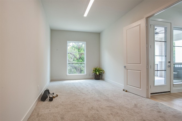 empty room featuring light colored carpet