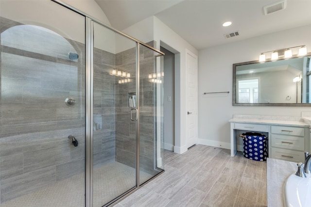 bathroom with vanity and independent shower and bath