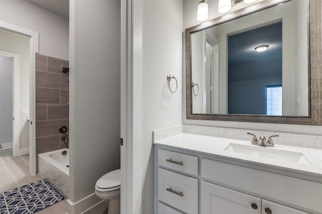 full bathroom with tiled shower / bath combo, vanity, and toilet