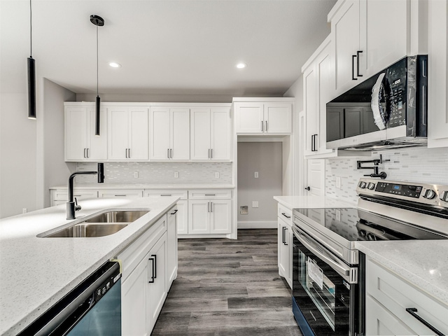 kitchen featuring sink, light stone counters, pendant lighting, white cabinets, and appliances with stainless steel finishes