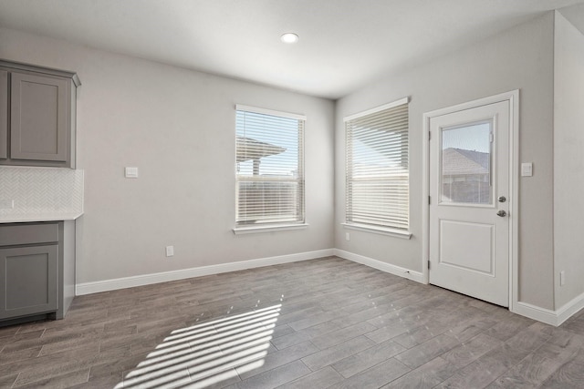 unfurnished dining area featuring light hardwood / wood-style floors