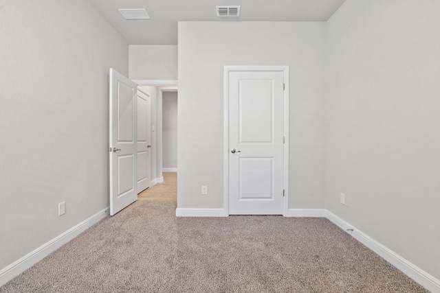 unfurnished bedroom with carpet