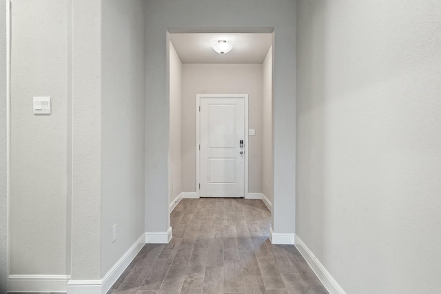 hall with light hardwood / wood-style floors