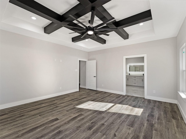 unfurnished bedroom featuring coffered ceiling, ceiling fan, dark wood-type flooring, beam ceiling, and connected bathroom