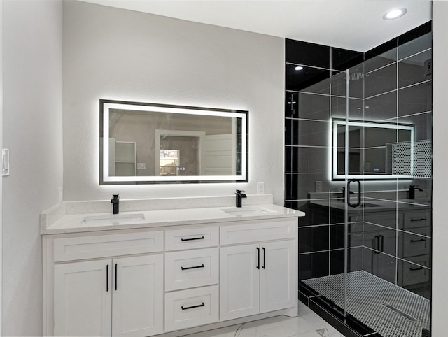 bathroom with vanity and walk in shower