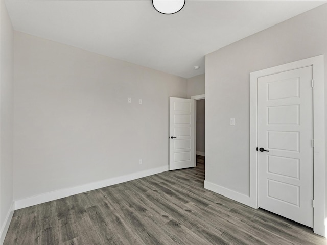 unfurnished bedroom featuring hardwood / wood-style flooring