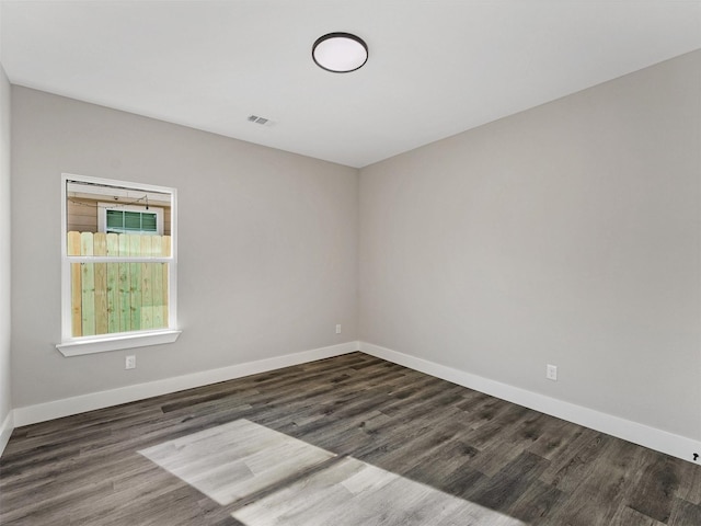 empty room featuring dark hardwood / wood-style floors