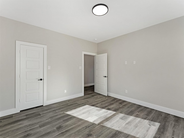 spare room featuring dark hardwood / wood-style floors