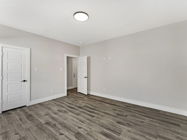 empty room featuring dark hardwood / wood-style floors