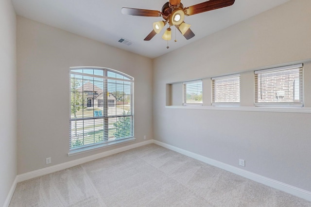 carpeted empty room with ceiling fan