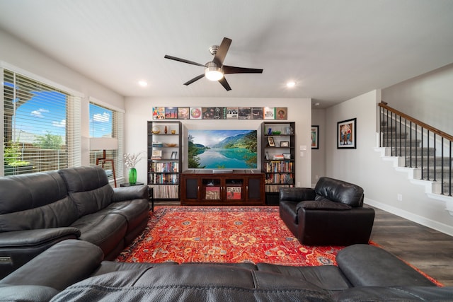 living room with hardwood / wood-style floors and ceiling fan