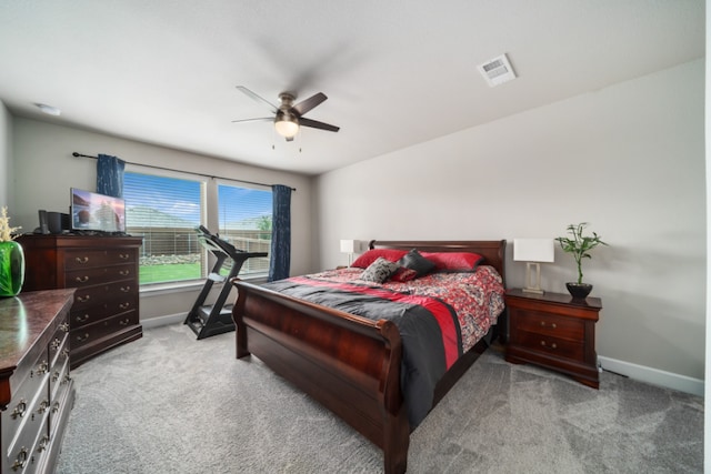 bedroom featuring ceiling fan and light carpet