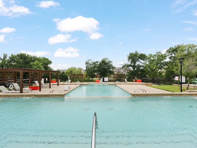 view of swimming pool with a patio area