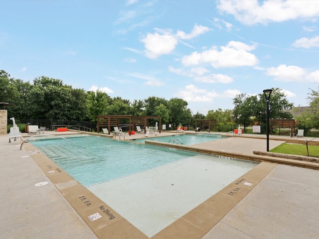 view of pool featuring a patio