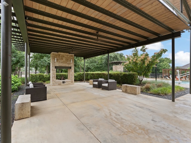 view of patio / terrace featuring an outdoor living space with a fireplace