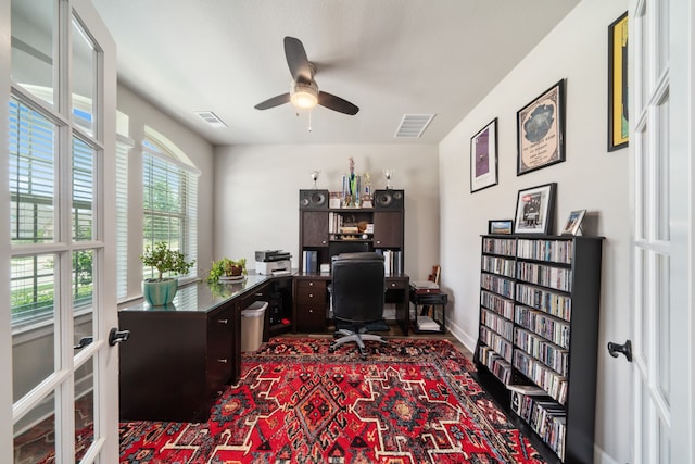 office space featuring french doors and ceiling fan