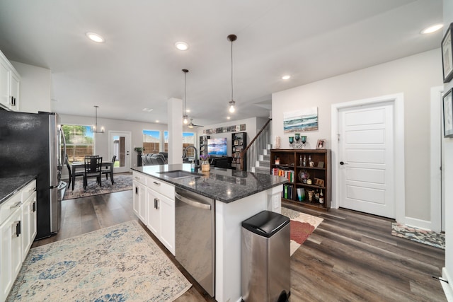 kitchen with white cabinetry, sink, an island with sink, and appliances with stainless steel finishes