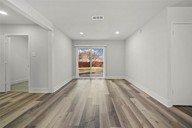 spare room featuring hardwood / wood-style flooring