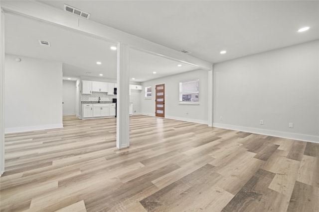 basement featuring light hardwood / wood-style flooring