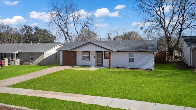 single story home featuring a front lawn