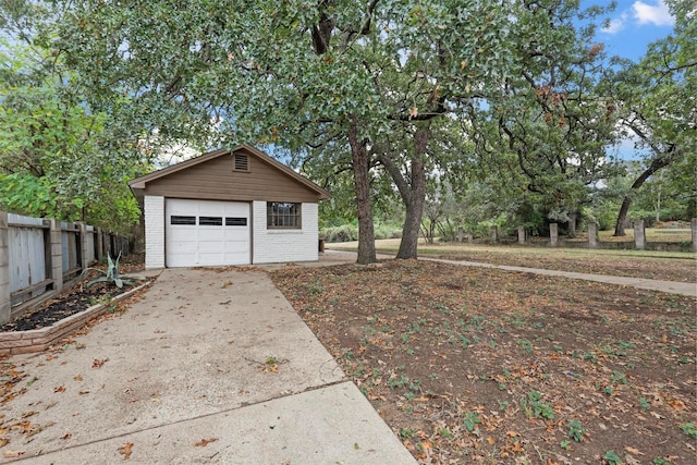 exterior space featuring a garage and an outdoor structure