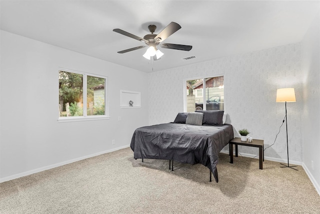 bedroom with ceiling fan and carpet floors