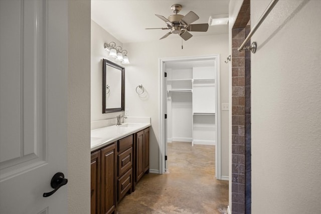 bathroom featuring vanity, concrete floors, and ceiling fan