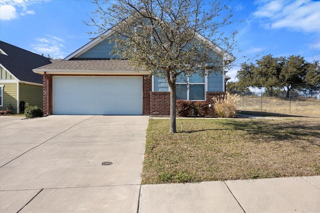 view of front of home with a garage and a front yard