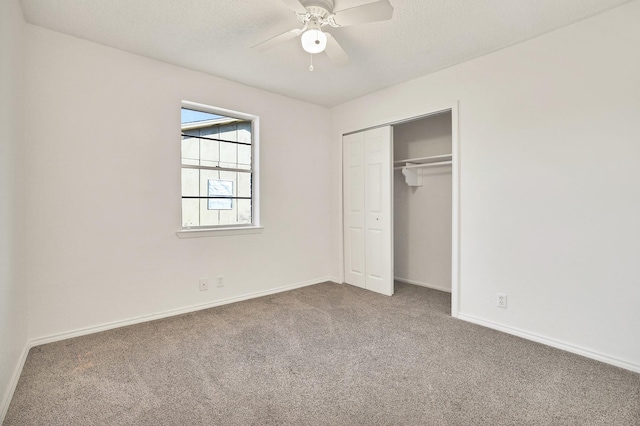 unfurnished bedroom featuring ceiling fan, carpet, a textured ceiling, and a closet