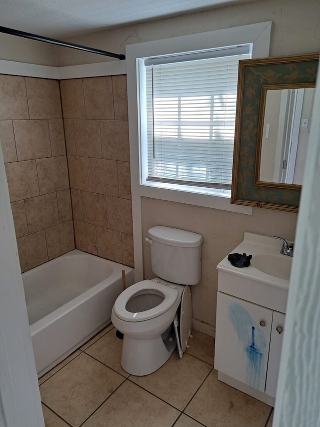 full bathroom with tile patterned flooring, vanity, toilet, and tiled shower / bath