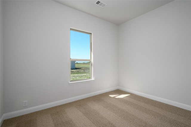 spare room with carpet floors